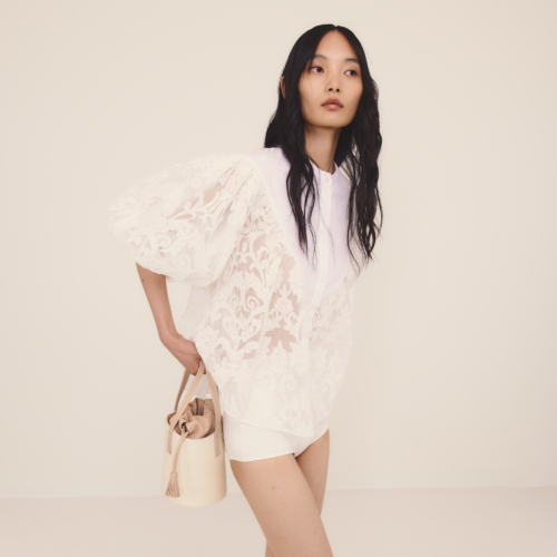 Blusa bianca in pizzo ricamato collo guru