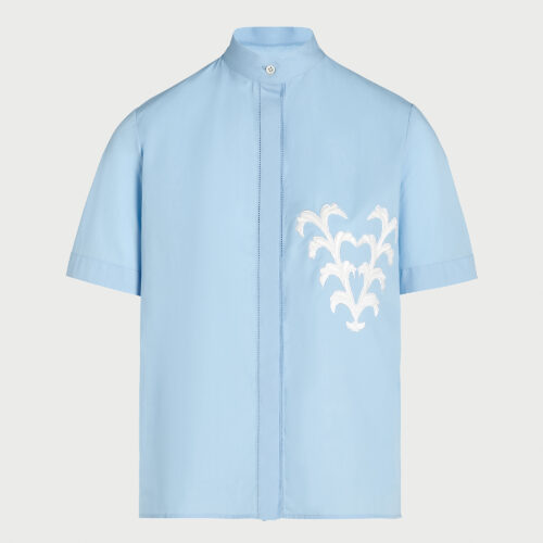 Blusa blu in popeline con V ricamata